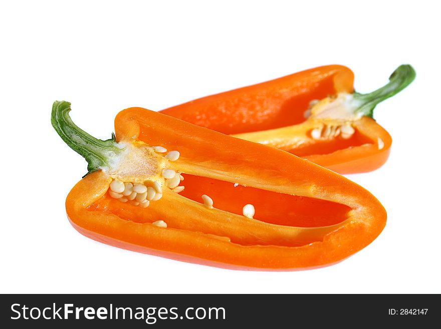 Two half of sliced orange bell pointed pepper, close-up, soft focus, white background, no shadow. Two half of sliced orange bell pointed pepper, close-up, soft focus, white background, no shadow