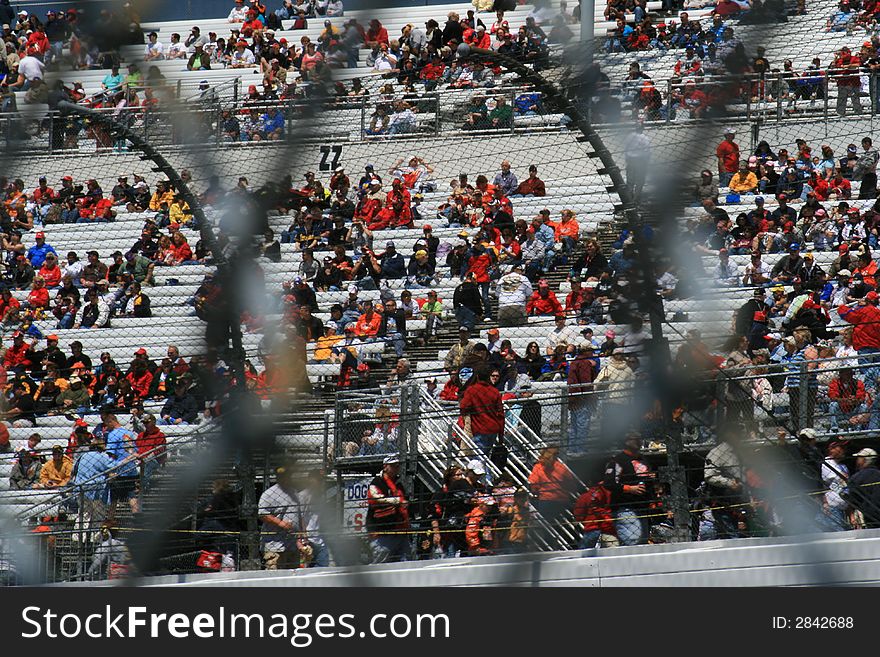 A View Through the Infield Fences to the Fans in the Stands at the 2007 Spring Race in Richmond. A View Through the Infield Fences to the Fans in the Stands at the 2007 Spring Race in Richmond