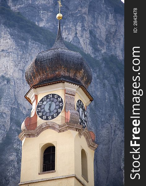 Church clock tower in the Italian alps. Church clock tower in the Italian alps