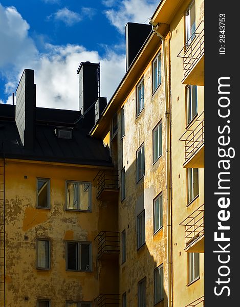 And old yellow apartment building in helsinki