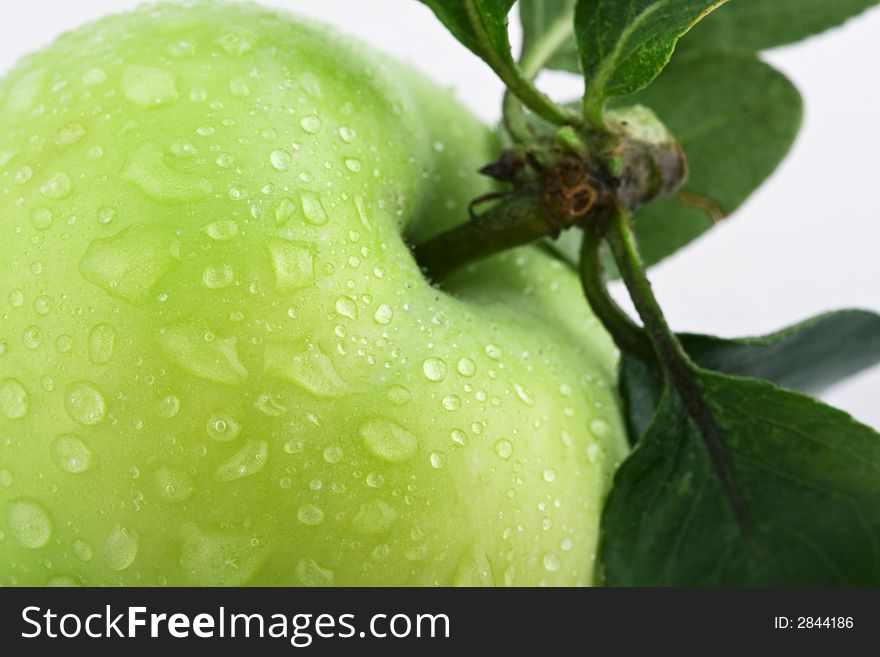 Green apple with water bubbles