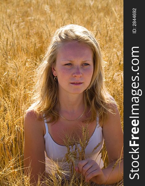 Pretty womans portrait in wheat field 2