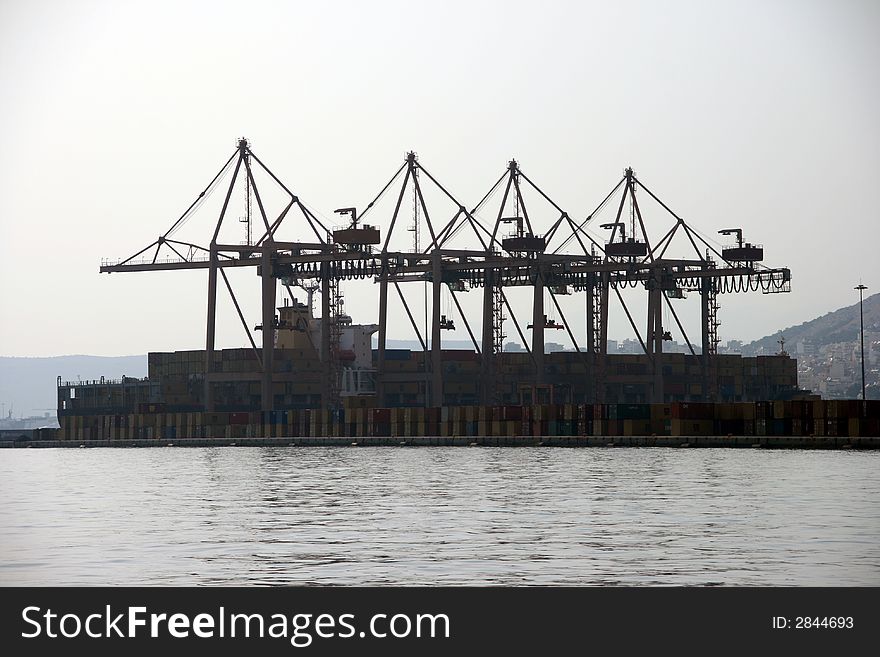 Container cranes at the commercial port of piraeus athens greece