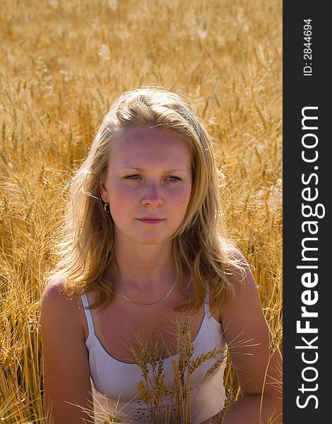 Pretty womans portrait in wheat field 3