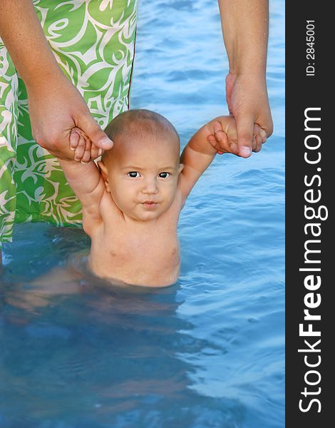 Father teaching his son to swim. Father teaching his son to swim