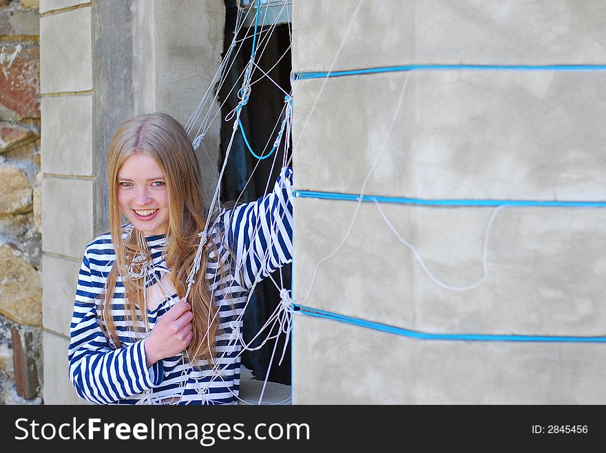 Smile blonde girl in sailor's strip vest. Smile blonde girl in sailor's strip vest