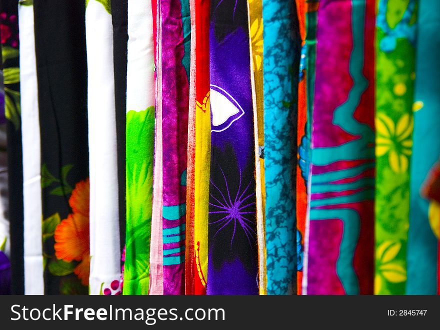 An abstract photograph of different textures of cloth and material on sale. Their individual patterns and colours exuding a colourful variation across the frame. An abstract photograph of different textures of cloth and material on sale. Their individual patterns and colours exuding a colourful variation across the frame