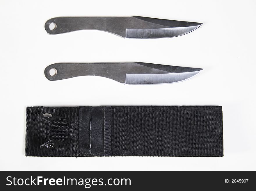 Two knifes with a sheath on white background. Two knifes with a sheath on white background