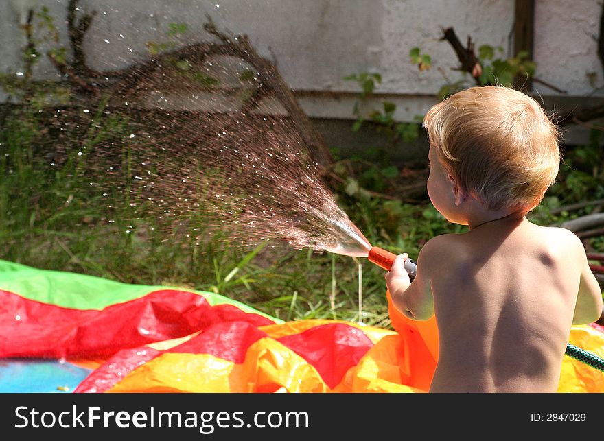 Young boy is playing in the garden. Young boy is playing in the garden