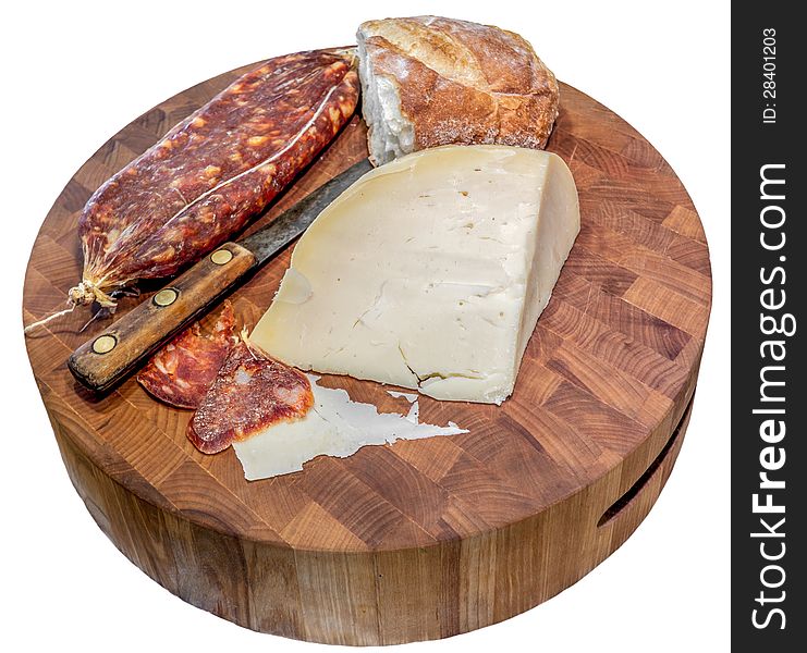 Sliced Italian dry salami with cheese and bread on a wood block cutting board. Sliced Italian dry salami with cheese and bread on a wood block cutting board