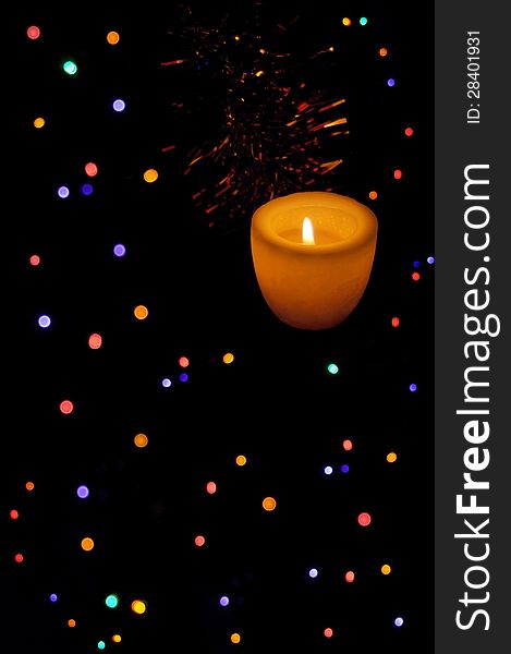 Colored lights over black with candle light. Colored lights over black with candle light