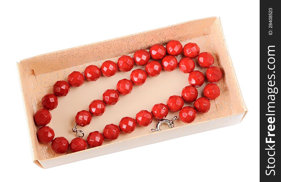 Coral necklace in a paper box isolated on white