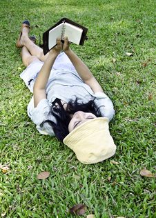 Young Woman Reading A Book In Park Stock Photo Young Woman Reading A Book In Park Stock Photo