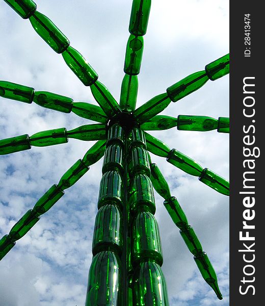 The image of palm tree made of bottles from a champagne