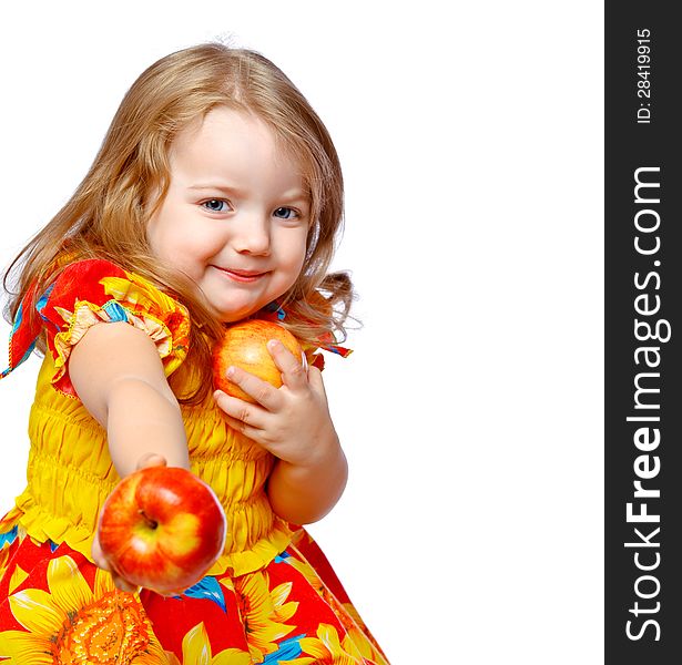 Beautiful little girl eating apples on an abstract background