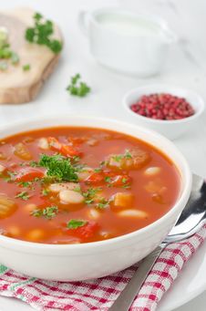 Bowl Of Roasted Tomato Soup With Beans, Celery And Bell Pepper, Stock Photo