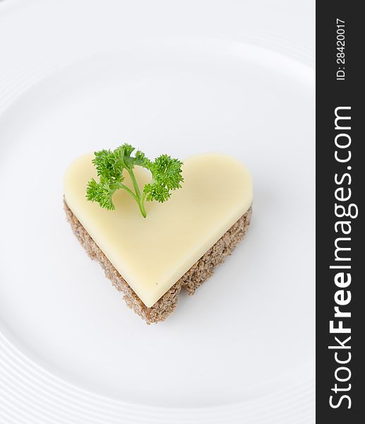 Appetizer with bread and cheese in the shape of heart