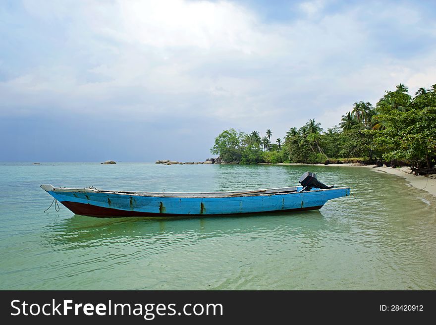 The boat, the beach and the blue sky