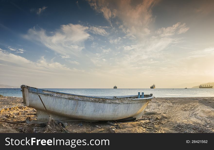 Old fishing boat after storm at the gulf of Aqaba