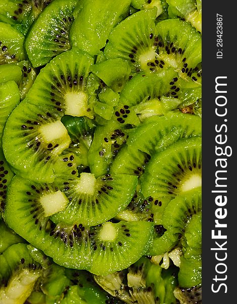 Healthy food background with green kiwi fruits slices