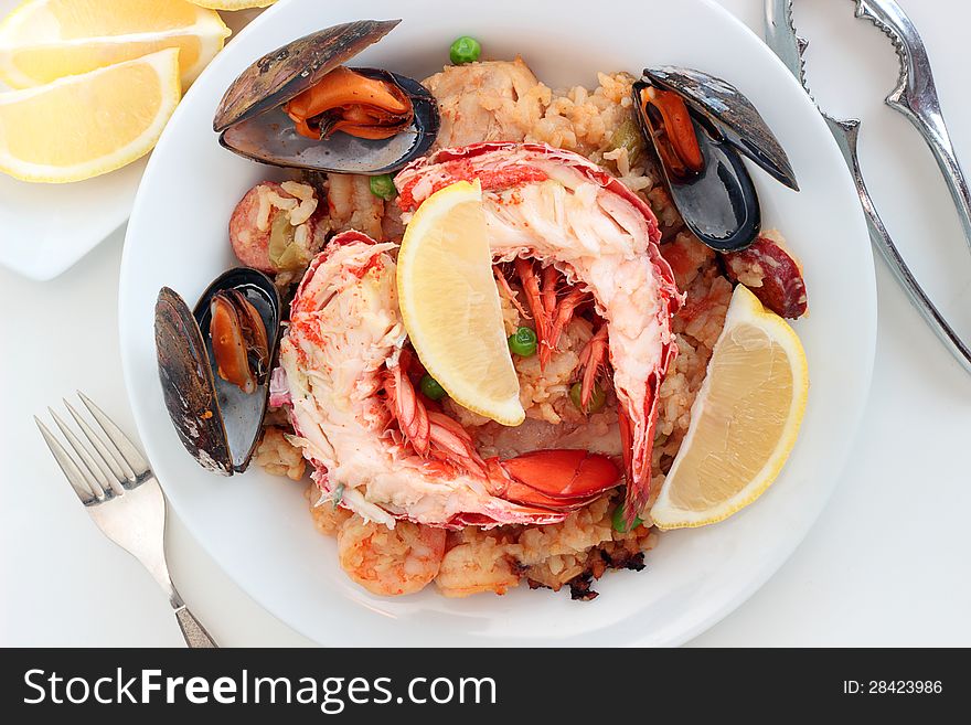 Spanish style cuisine dish filled with chicken seafood and sausage. Spanish style cuisine dish filled with chicken seafood and sausage