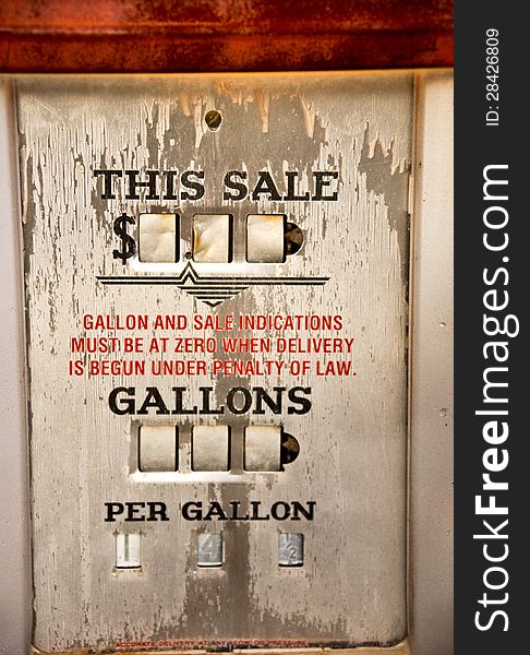 Weathered sign on a vintage gas pump, showing the price as US 14-1/2 cents per gallon. Weathered sign on a vintage gas pump, showing the price as US 14-1/2 cents per gallon.
