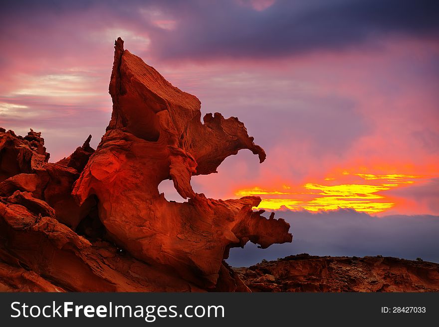 Sandstone Formation under stormy clouds and sunset, near Virgin River Recreation Lands, Nevada. Sandstone Formation under stormy clouds and sunset, near Virgin River Recreation Lands, Nevada