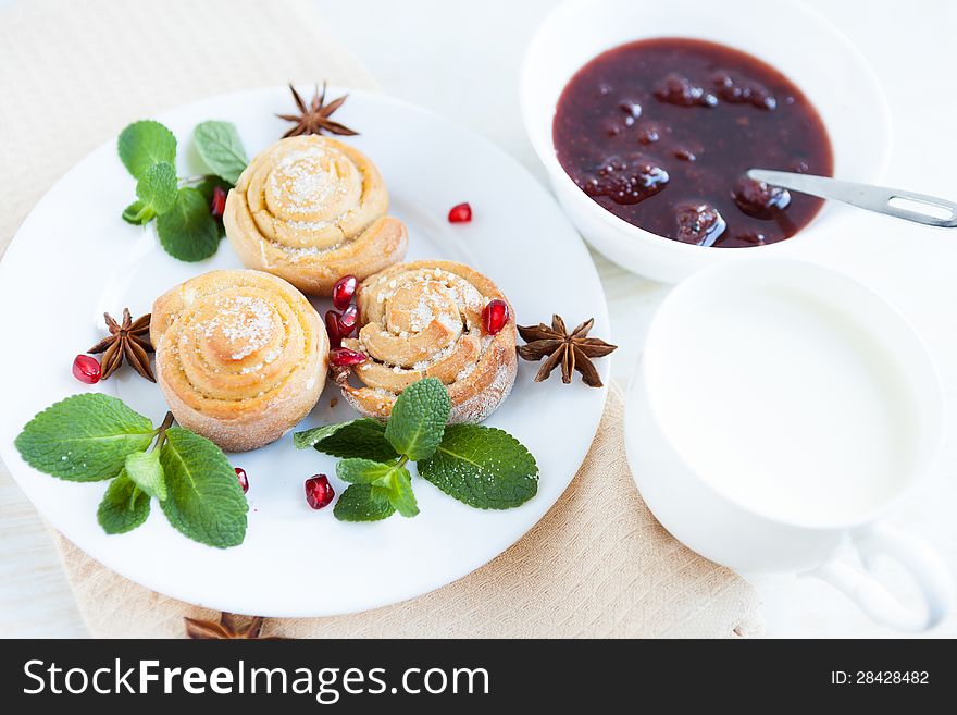 Buns, milk and jam - sweet breakfast