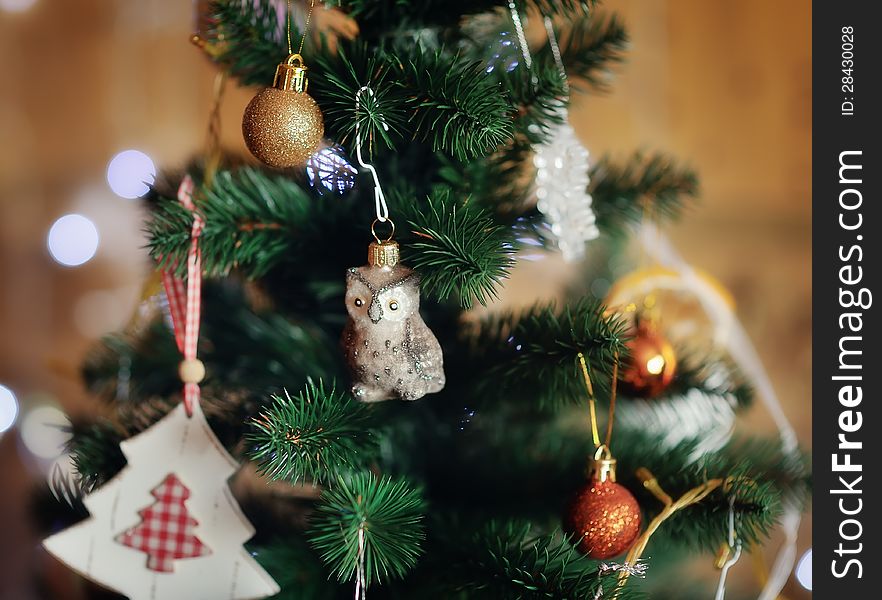 The New Year tree is decorated by toys the made hands. The New Year tree is decorated by toys the made hands