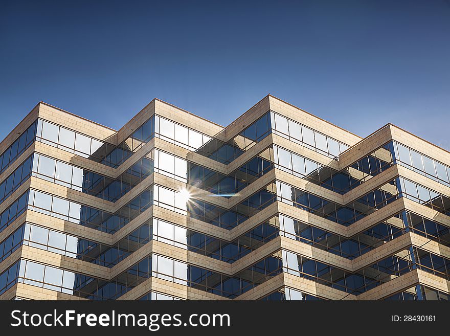 Modern Office Building Glowing In Sunshine