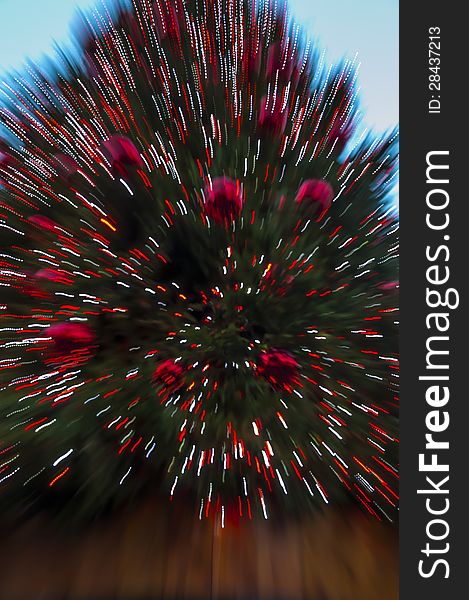 Zoomed photo pf a Christmas Tree looks as an explosion of colors and light.