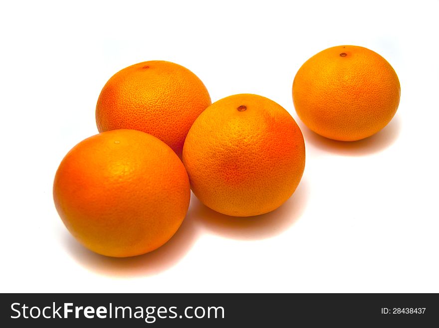 Four fresh tangerines on white