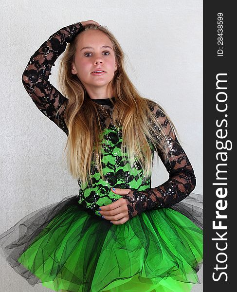 Pre-teen Dancer Posing With Bright Green Dance Costume. Pre-teen Dancer Posing With Bright Green Dance Costume