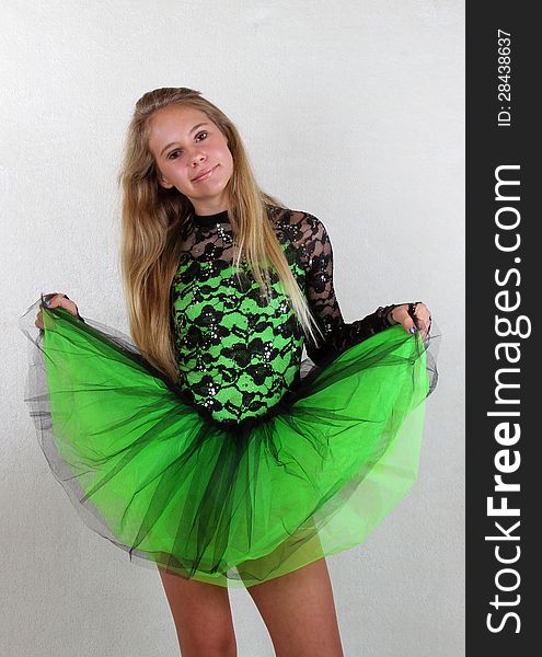 Preteen Dancer Posing With Bright Green Dance Costume. Preteen Dancer Posing With Bright Green Dance Costume