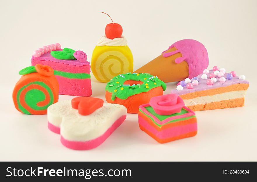 The pile of colorful sweet goods made of play dough. The pile of colorful sweet goods made of play dough