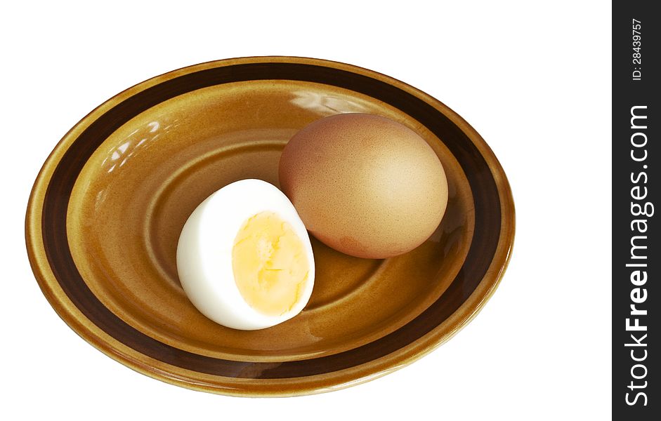 Boiled eggs on ceramic small plate isolated over white background