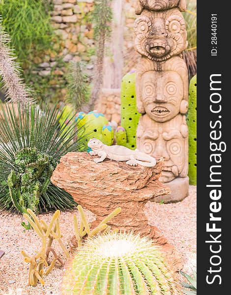 Dragon lizard sculpture in desert garden
