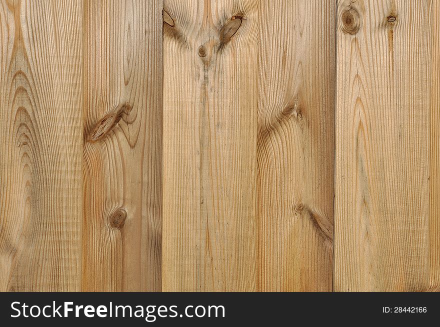 Slats of a wooden panel (pine) forming a background. Slats of a wooden panel (pine) forming a background
