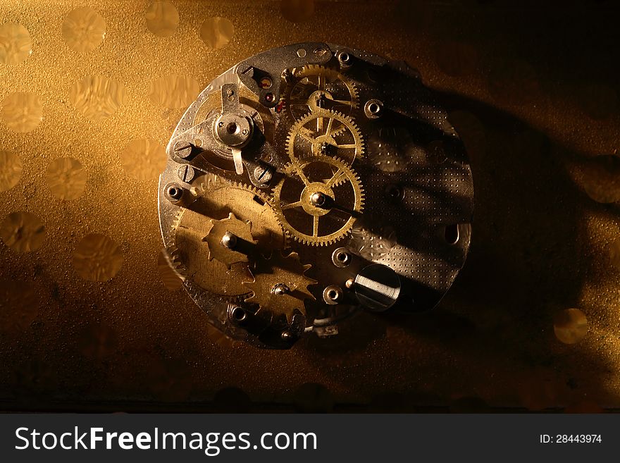 Closeup of old brass clock mechanism. Conceptual background. Closeup of old brass clock mechanism. Conceptual background