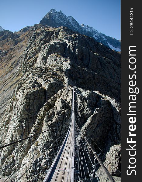 Trift suspension footbridge, Europe's highest situated rope suspension bridge, The Alps, Switzerland, Europe. Trift suspension footbridge, Europe's highest situated rope suspension bridge, The Alps, Switzerland, Europe