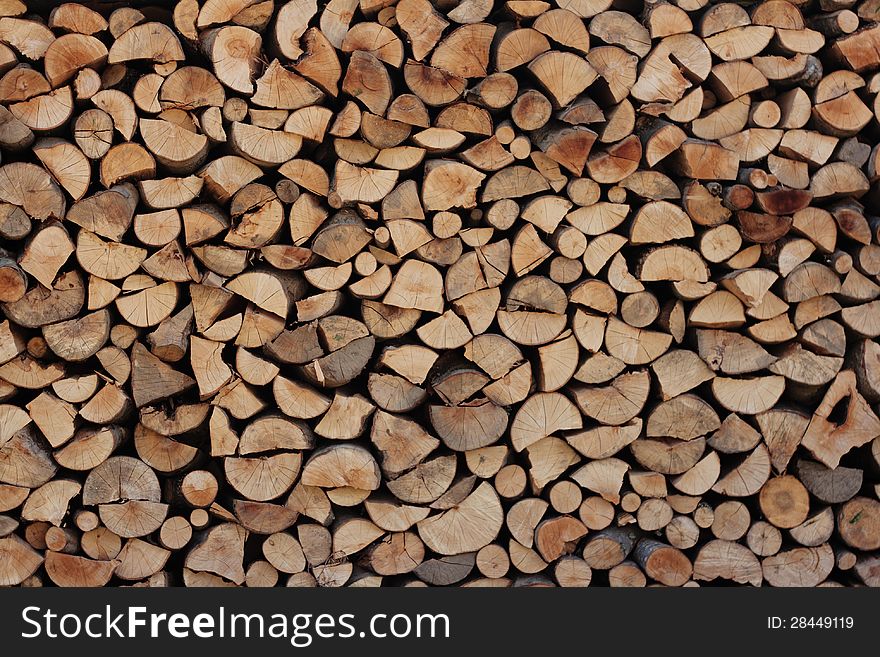A wall of chopped wood texture background. A wall of chopped wood texture background