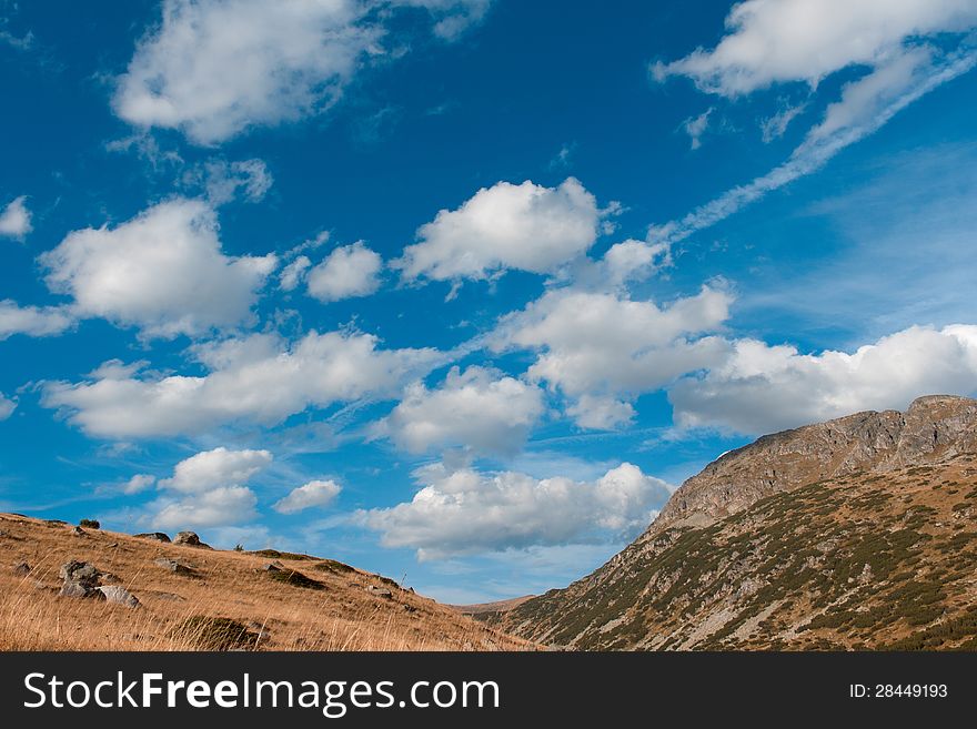 Rila mountain sunny sky full of clouds