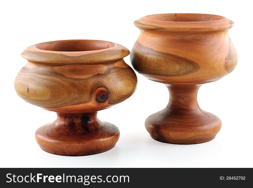 Two wooden bowls carved from the eucalyptus tree photographed against a white background