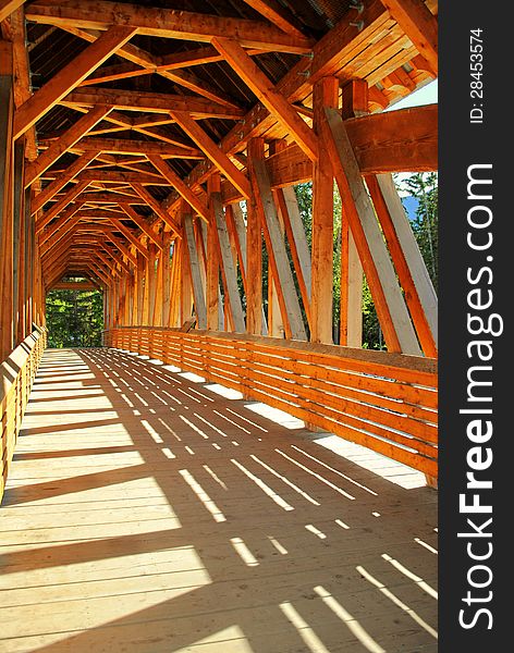 Wood framed pedestrian bridge in Golden, BC, Canada