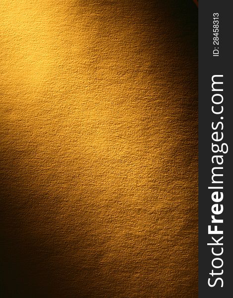 Old yellow paper surface with beam of light. Good background for your text. Old yellow paper surface with beam of light. Good background for your text