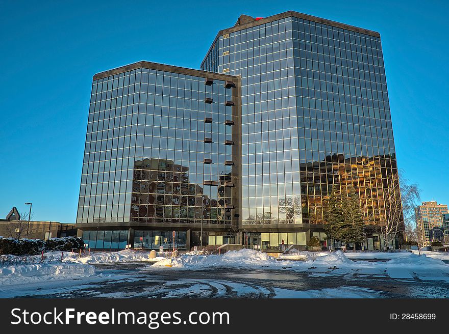 Modern glass building wintertime late afternoon