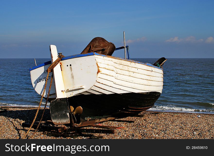 Boats Beached On A Shingle Beach