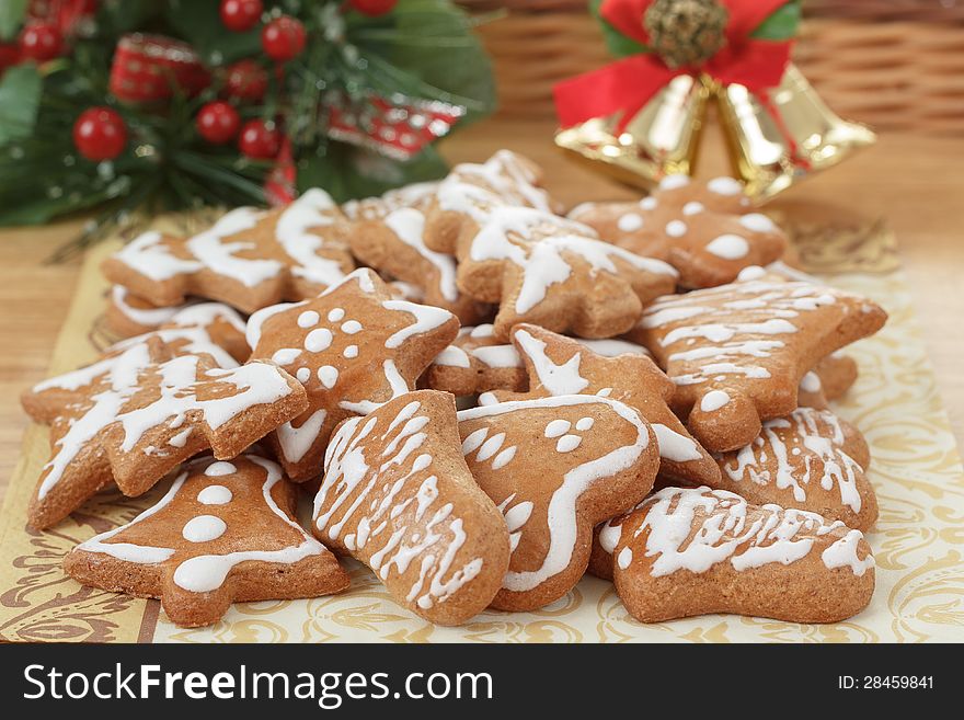 Christmas Gingerbreads And Decoration On Wooden Table