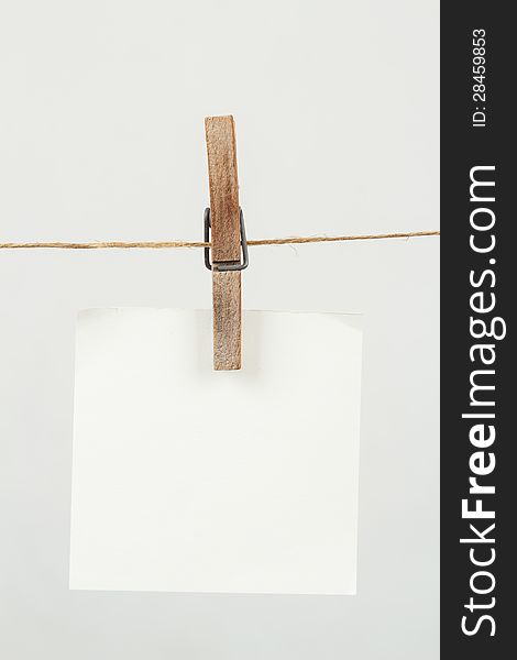 White memory note paper hanging on cord