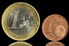 Two Used Coin - One Euro And One Eurocent Stock Photos